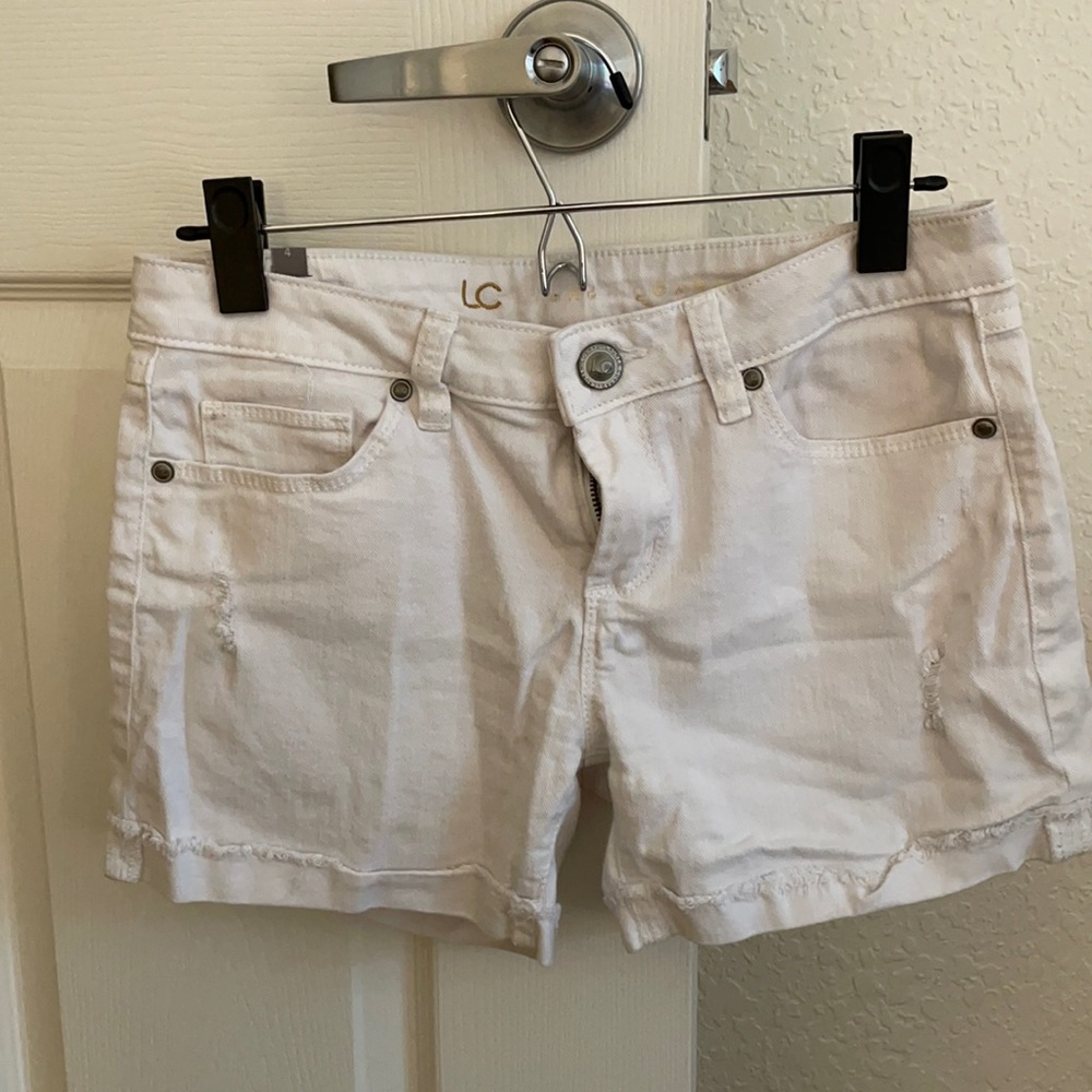 White denim distressed shorts